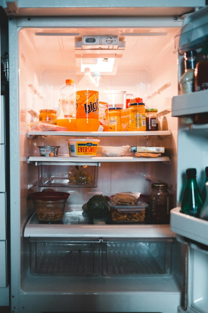 "Organized fridge with containers for safe food storage."