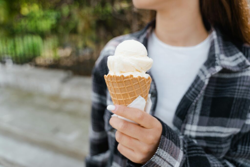 person celebrating small wins with ice cream treat to stay motivated.